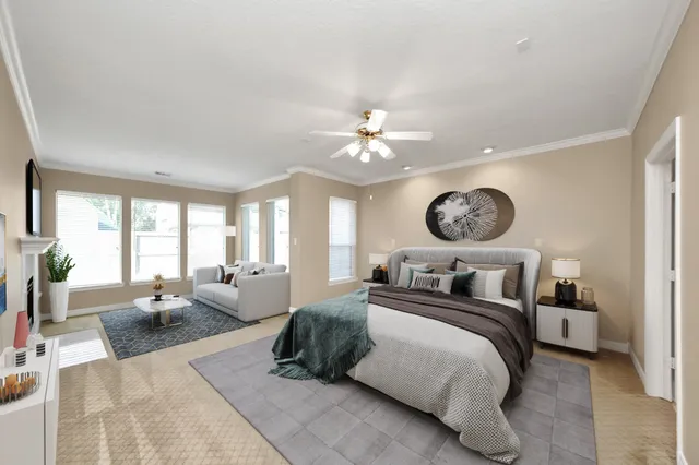 a bedroom with a large bed and a large mirror