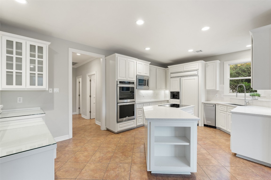 127 Roberts Circle Georgetown, TX 78633 - Photo 15 of 35 a large white kitchen with a stove a sink and a refrigerator