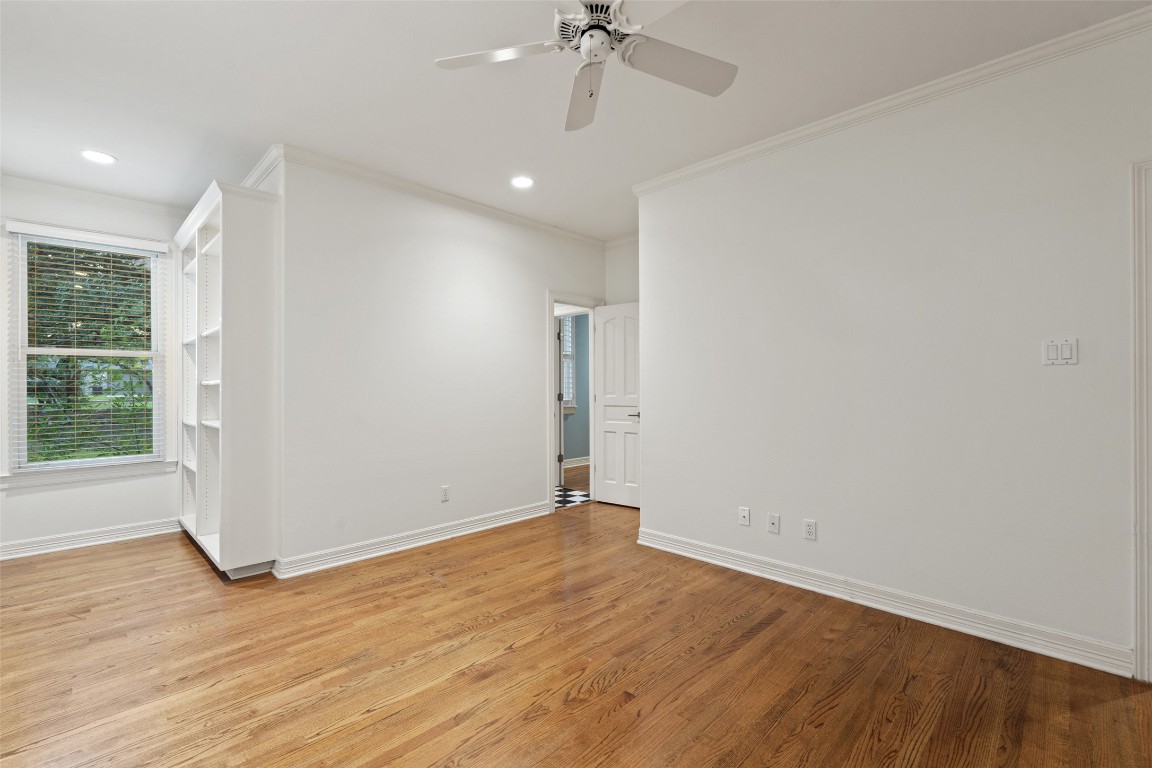 127 Roberts Circle Georgetown, TX 78633 - Photo 4 of 35 an empty room with wooden floor fan and windows
