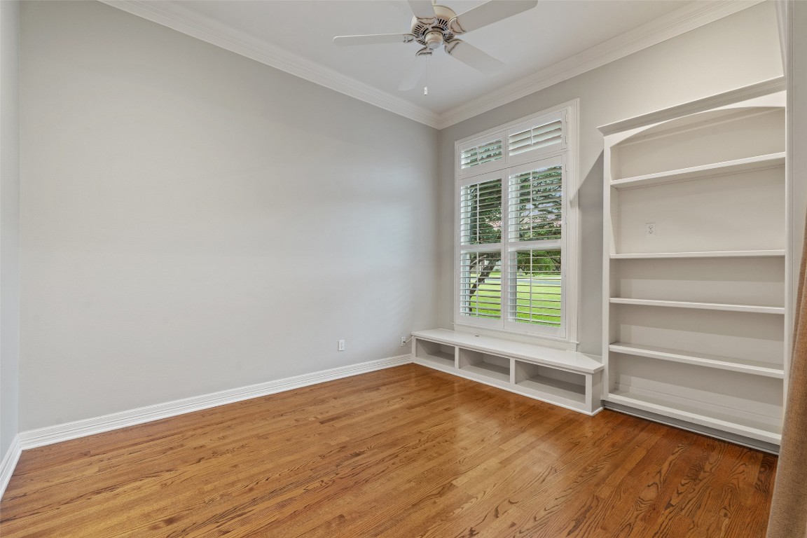 127 Roberts Circle Georgetown, TX 78633 - Photo 8 of 35 a view of an empty room with a window and wooden floor