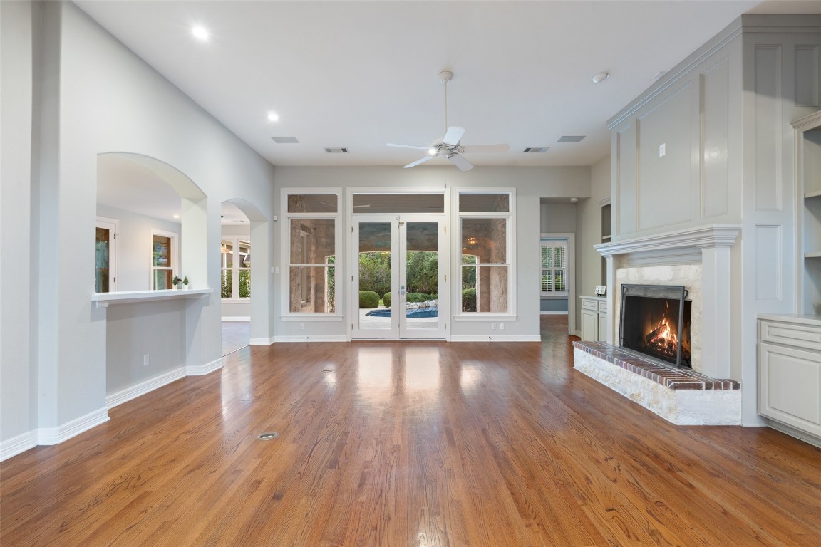 127 Roberts Circle Georgetown, TX 78633 - Photo 10 of 35 an empty room with wooden floor and a fireplace