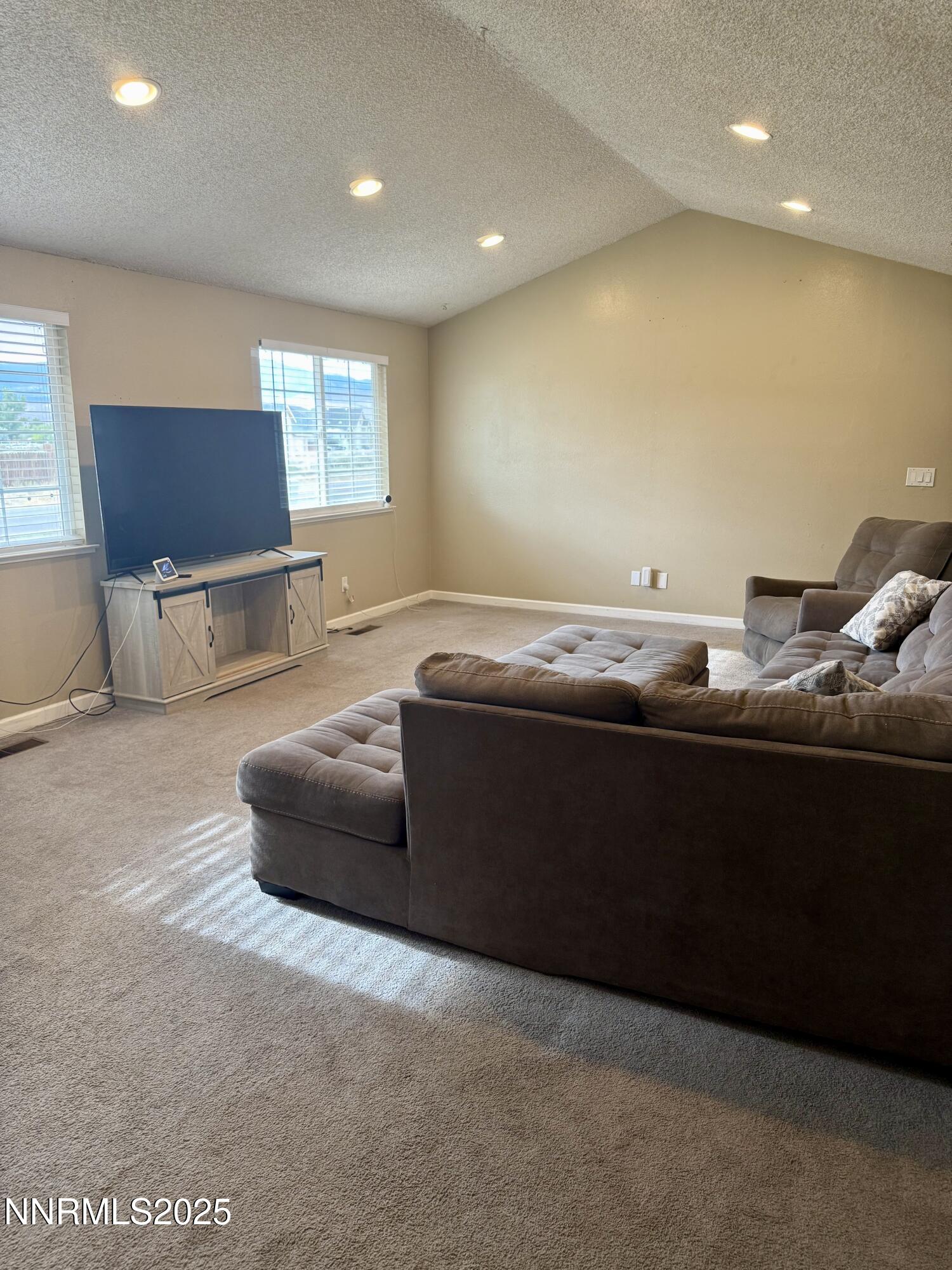 2775 Vicky Lane Minden, NV 89423 - Photo 2 of 6 a living room with furniture and a flat screen tv