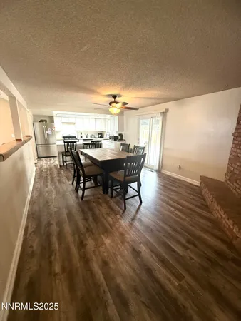a view of a dining room with furniture and window