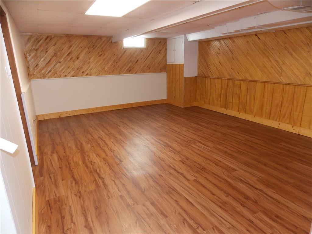 511 Pearl Avenue Mars, PA 16046 - Photo 12 of 20 a view of an empty room with wooden floor and a window