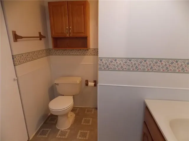 a bathroom with a toilet and a sink