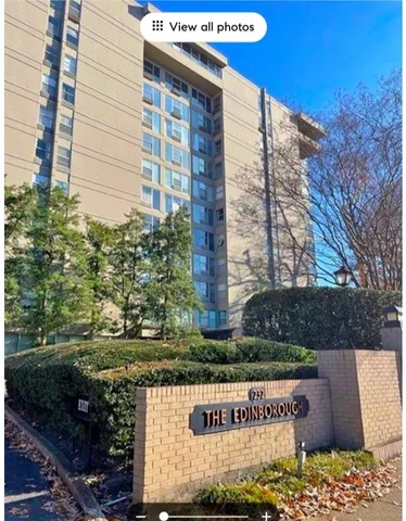 a view of a street with a building in the background
