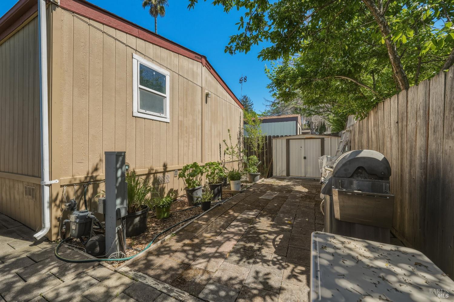 436 McCoy Avenue Santa Rosa, CA 95407 - Photo 23 of 27 a backyard of a house with seating space