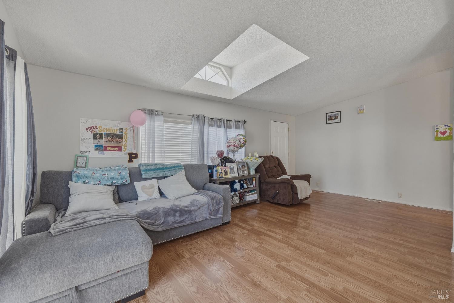 436 McCoy Avenue Santa Rosa, CA 95407 - Photo 4 of 27 a living room with furniture and a wooden floor