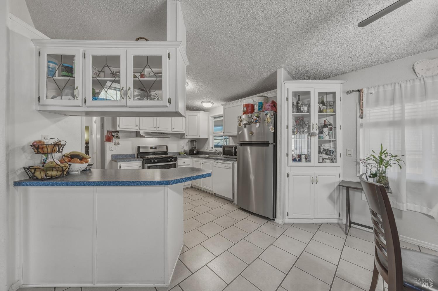 436 McCoy Avenue Santa Rosa, CA 95407 - Photo 8 of 27 a kitchen with stainless steel appliances a refrigerator and a sink