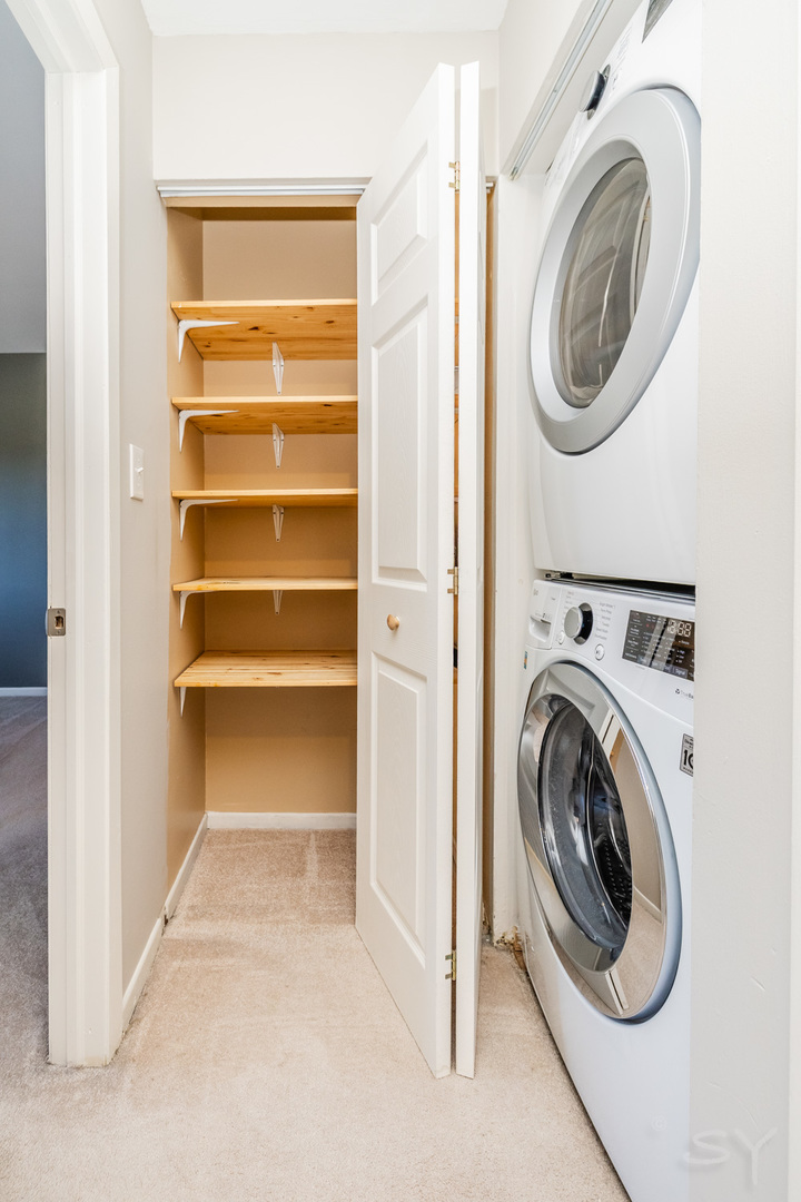 1440 Stonebridge Circle, Unit J7 Wheaton, IL 60189 - Photo 11 of 28 a view of a storage & utility room with washer and dryer