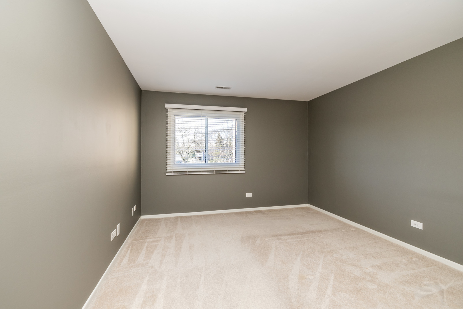 1440 Stonebridge Circle, Unit J7 Wheaton, IL 60189 - Photo 12 of 28 a view of room with window