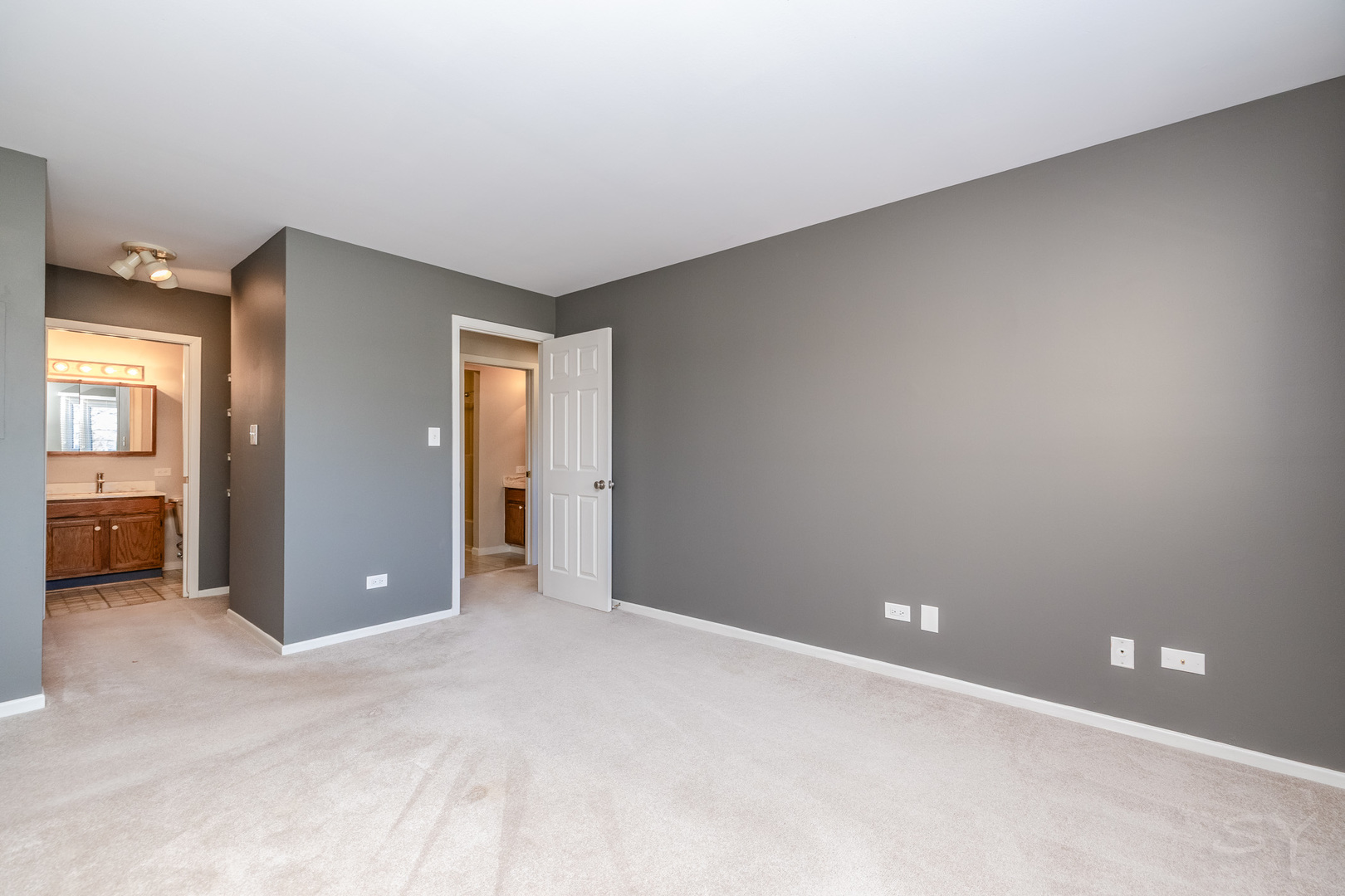 1440 Stonebridge Circle, Unit J7 Wheaton, IL 60189 - Photo 13 of 28 a view of an empty room with a bathroom