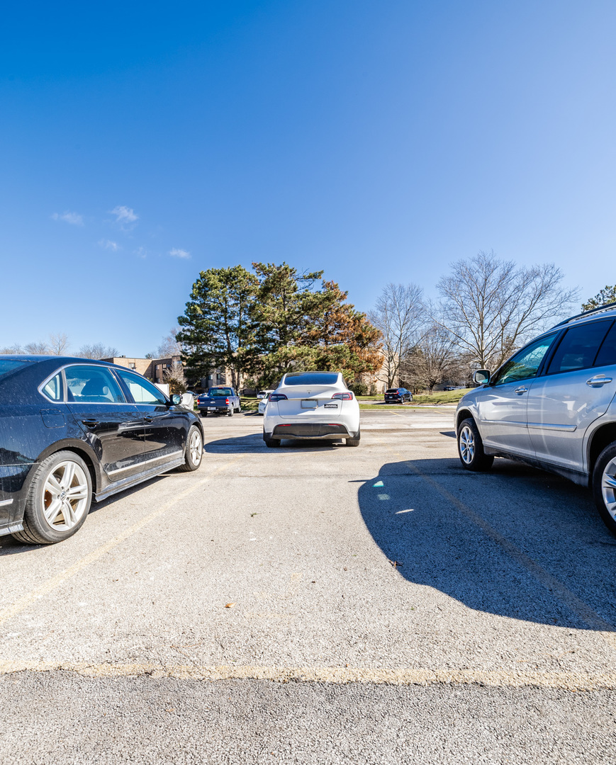 1440 Stonebridge Circle, Unit J7 Wheaton, IL 60189 - Photo 24 of 28 a view of parking with cars parked