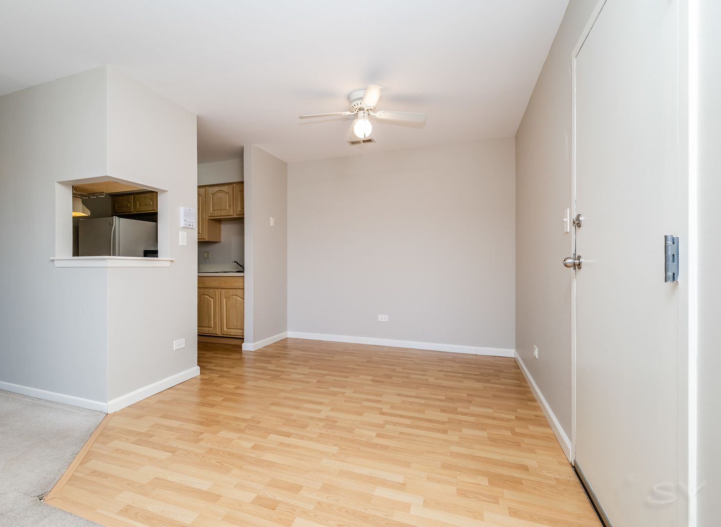 1440 Stonebridge Circle, Unit J7 Wheaton, IL 60189 - Photo 6 of 28 a view of a livingroom with a chandelier