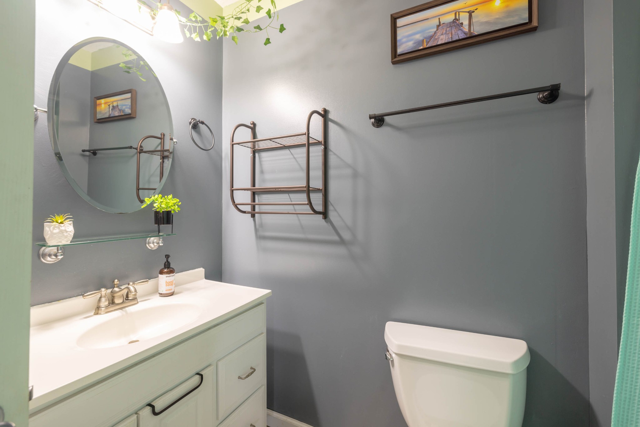 135 Corinth Road Portland, TN 37148 - Photo 18 of 44 a bathroom with a toilet a sink and mirror