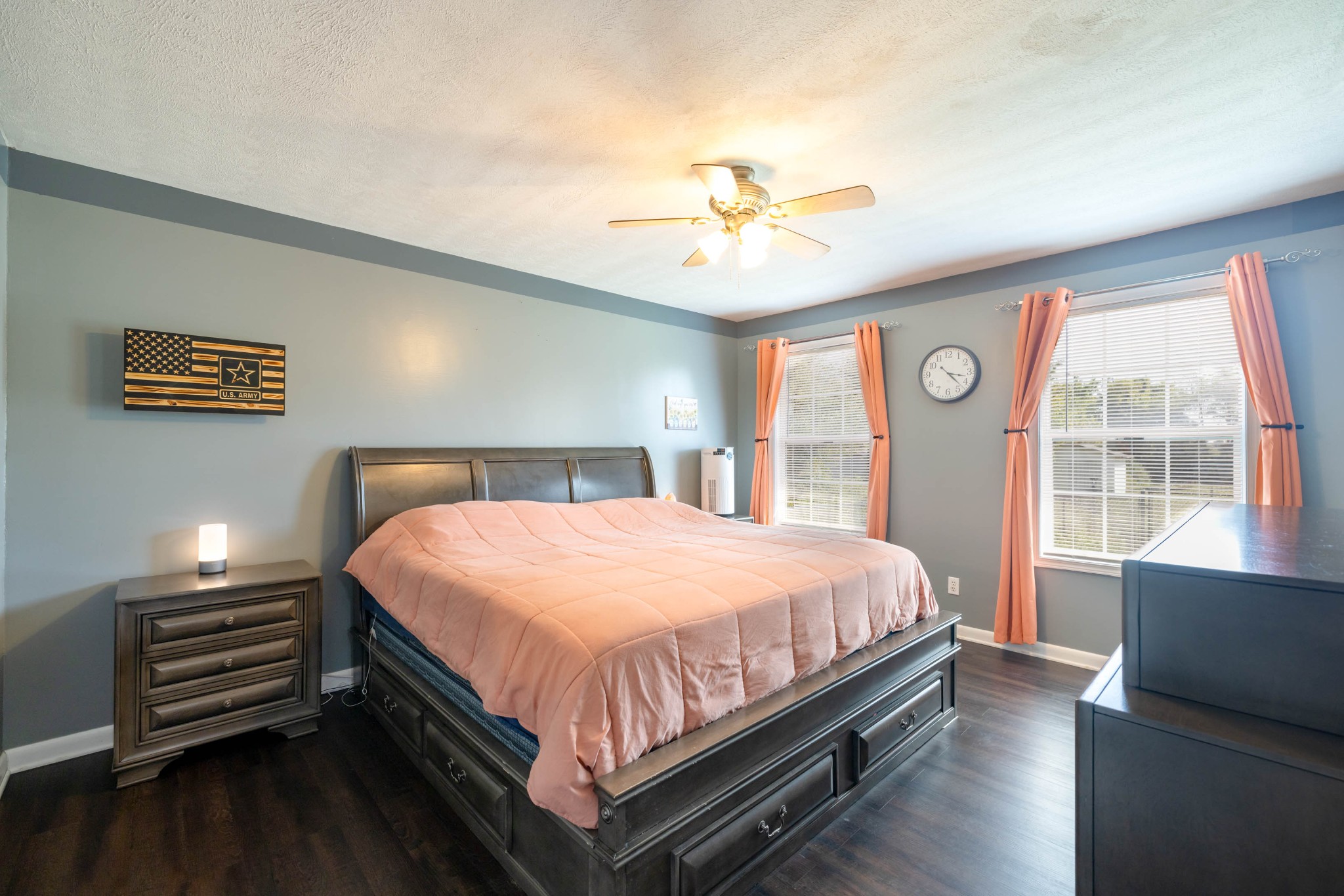 135 Corinth Road Portland, TN 37148 - Photo 25 of 44 a bedroom with a bed and a chandelier