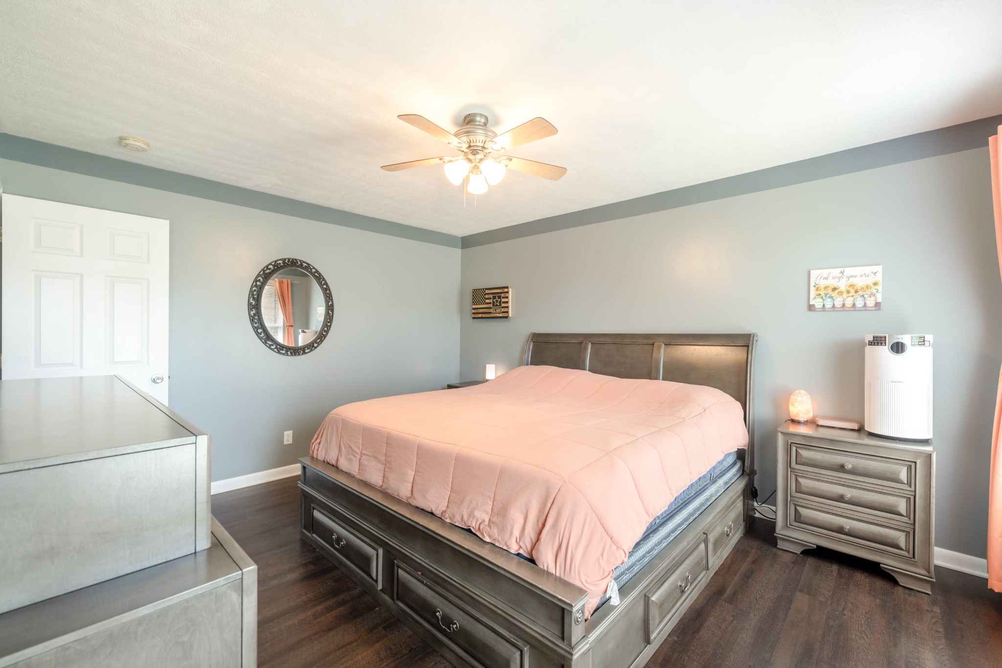 135 Corinth Road Portland, TN 37148 - Photo 27 of 44 a bedroom with a bed and a chandelier