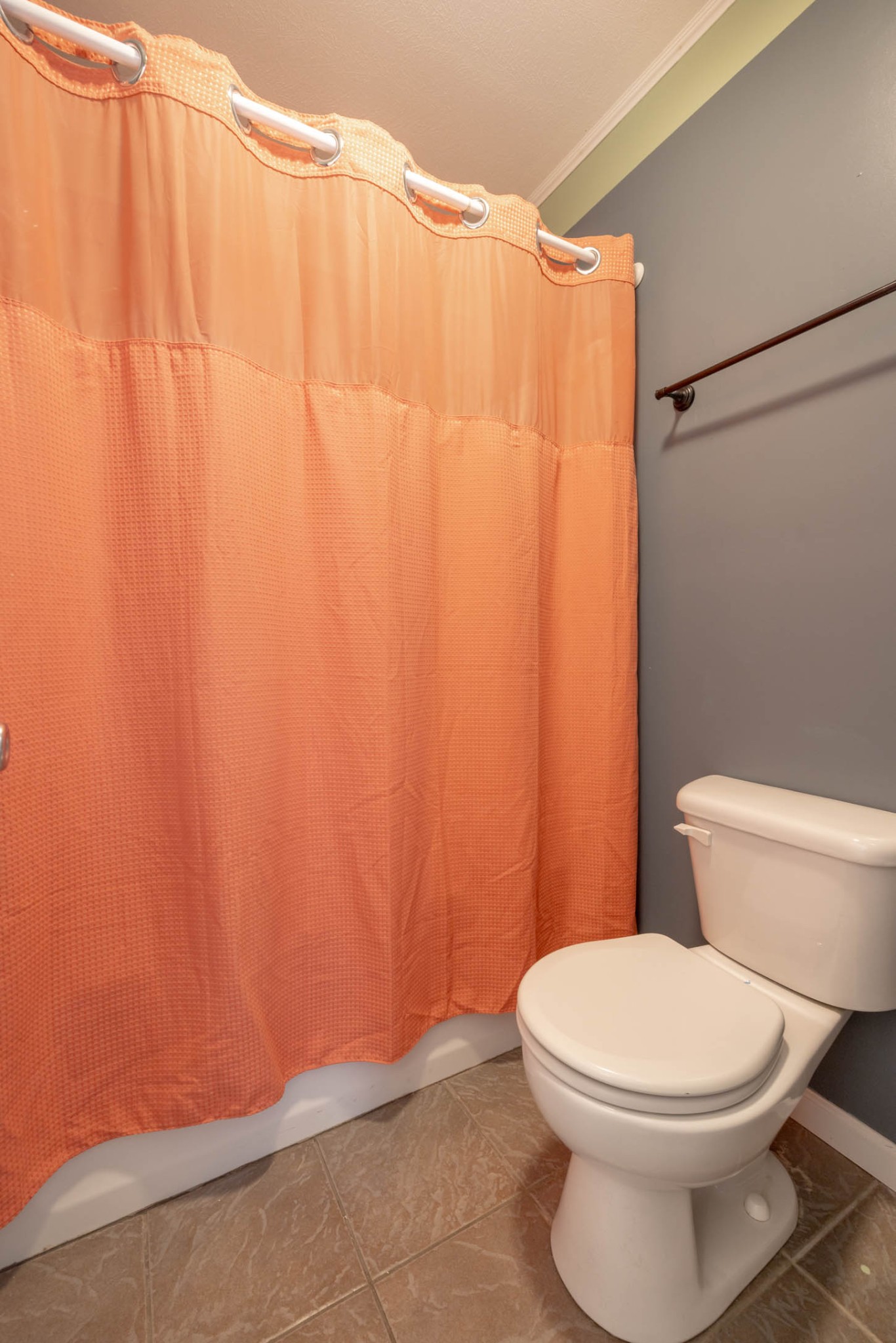 135 Corinth Road Portland, TN 37148 - Photo 31 of 44 a white toilet sitting next to a shower curtain