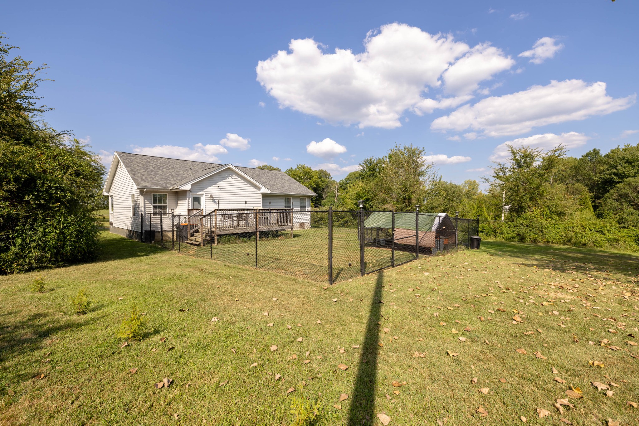 135 Corinth Road Portland, TN 37148 - Photo 35 of 44 a swimming pool with trees in the background