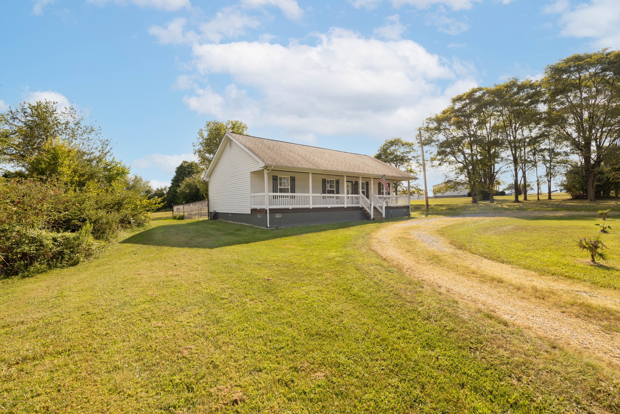 135 Corinth Road Portland, TN 37148 - Photo 37 of 44 a view of a swimming pool with an outdoor space and seating area