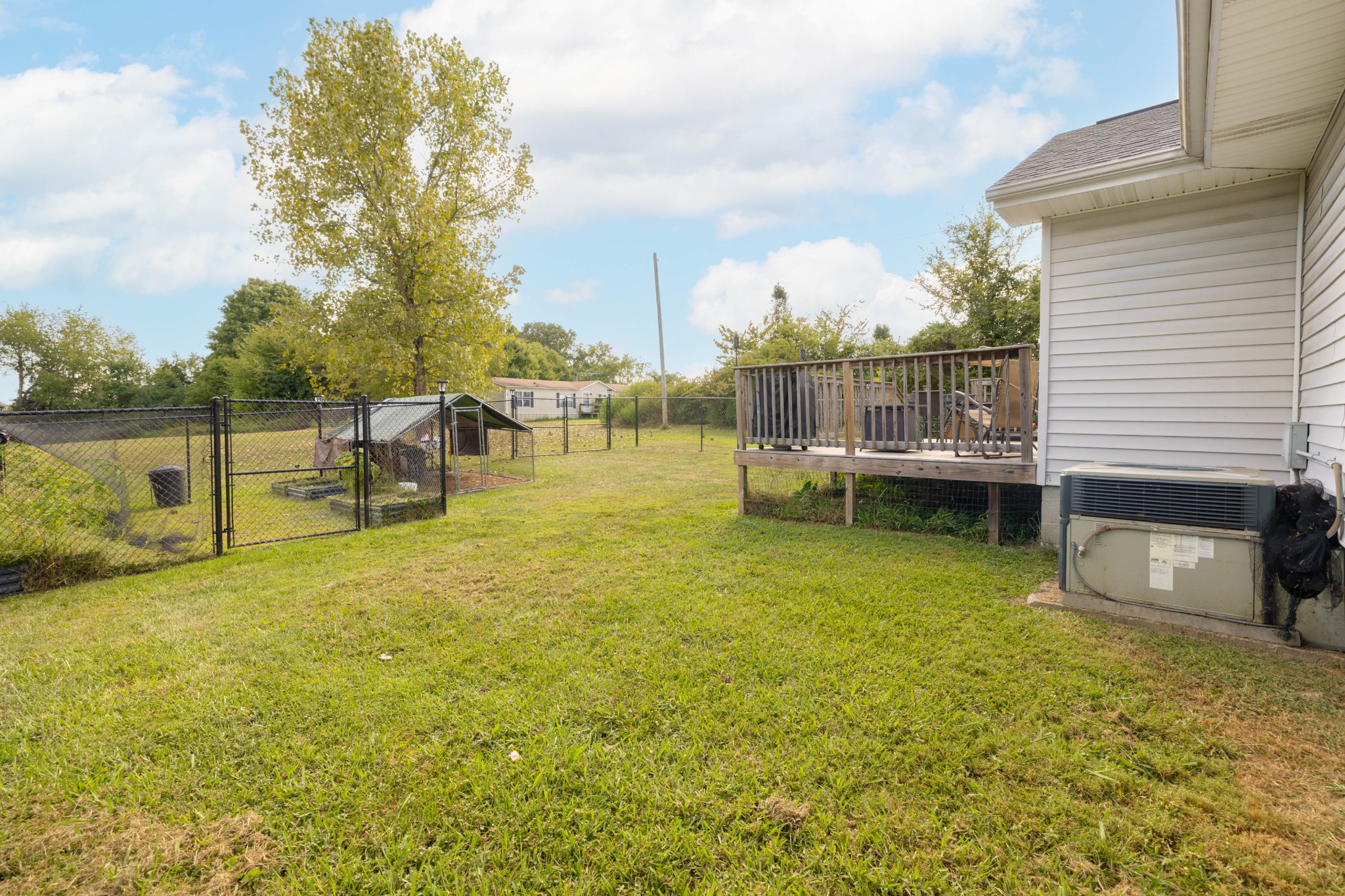 135 Corinth Road Portland, TN 37148 - Photo 43 of 44 a view of a lake with a house in the background