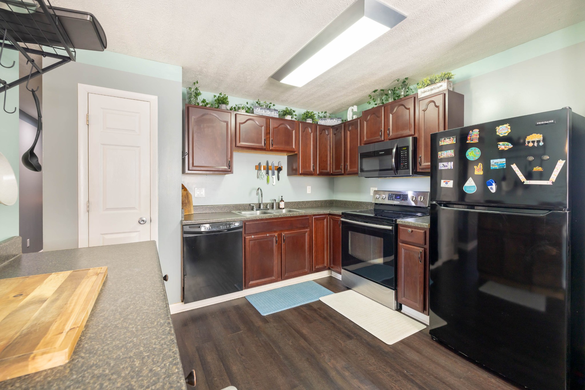 135 Corinth Road Portland, TN 37148 - Photo 6 of 44 a kitchen with granite countertop a refrigerator stove and sink