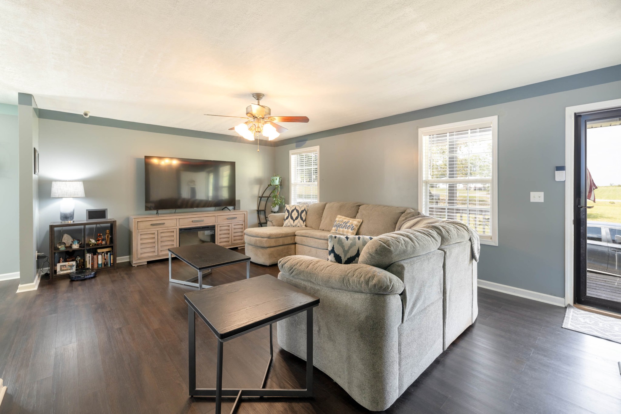 135 Corinth Road Portland, TN 37148 - Photo 8 of 44 a living room with furniture and a flat screen tv with wooden floor