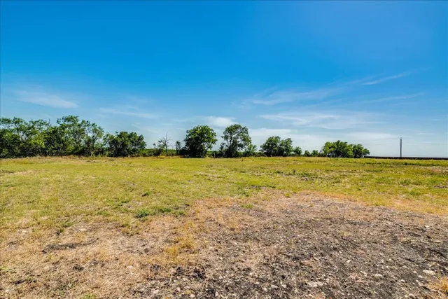 a view of balcony with wooden floor