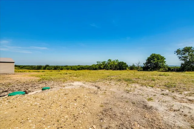 a house with swimming pool in front of it