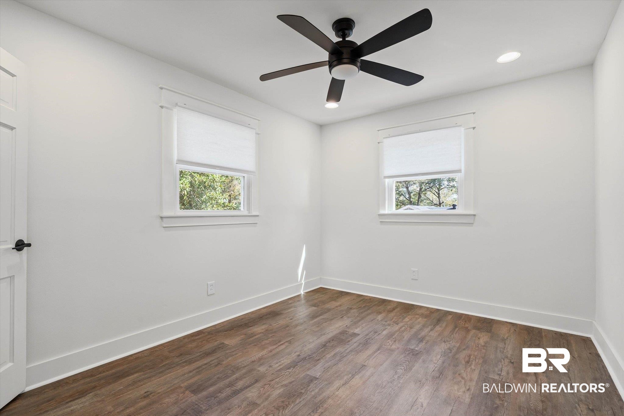 3933 Radnor Avenue Mobile, AL 36608 - Photo 21 of 36 Spare room with dark wood finished floors, plenty of natural light, ceiling fan, and recessed lighting.