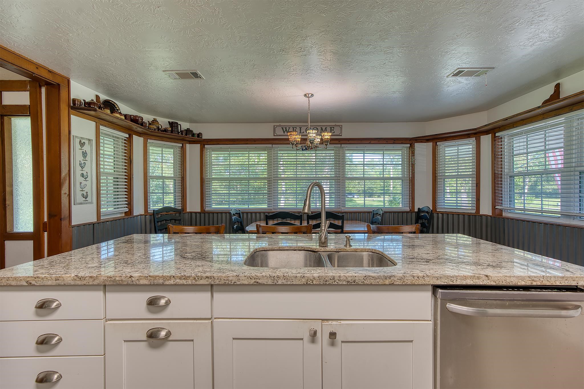 7476 Foard Road Beaumont, TX 77705 - Photo 20 of 49 a kitchen with granite countertop a stove a sink and a granite counter tops