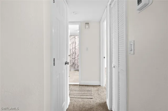 a view of a bathroom with a shower and a bathroom