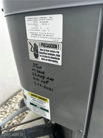 an aerial view of a house with garden space and street view