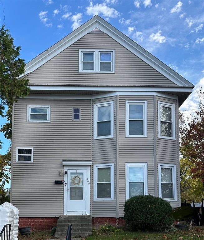 369 Chestnut Street Clinton, MA 01510 - Photo 1 of 21 a front view of a house with garden