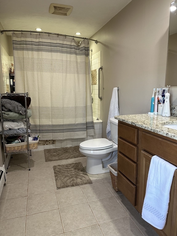 369 Chestnut Street Clinton, MA 01510 - Photo 12 of 21 a bathroom with a granite countertop sink a toilet and a mirror