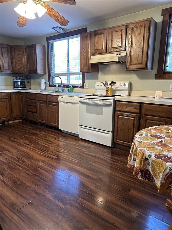 369 Chestnut Street Clinton, MA 01510 - Photo 15 of 21 a kitchen with granite countertop wooden floors a sink and cabinets