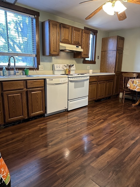 369 Chestnut Street Clinton, MA 01510 - Photo 16 of 21 a kitchen with stainless steel appliances granite countertop a sink cabinets and wooden floor