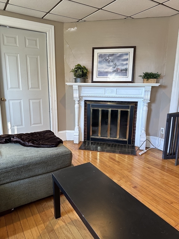 369 Chestnut Street Clinton, MA 01510 - Photo 17 of 21 a living room with furniture and a fireplace