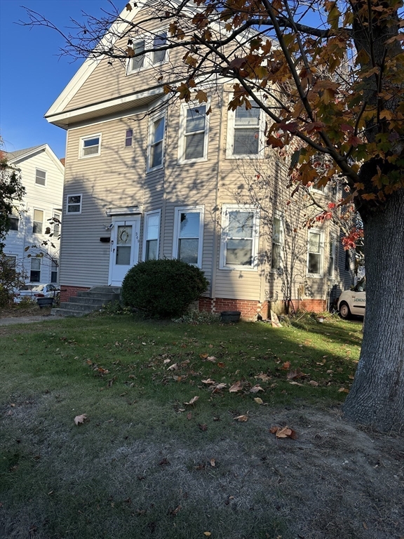 369 Chestnut Street Clinton, MA 01510 - Photo 21 of 21 a front view of a house with garden