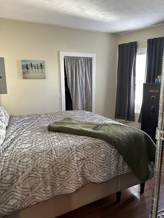 369 Chestnut Street Clinton, MA 01510 - Photo 8 of 21 a bedroom with a bed and wooden floor