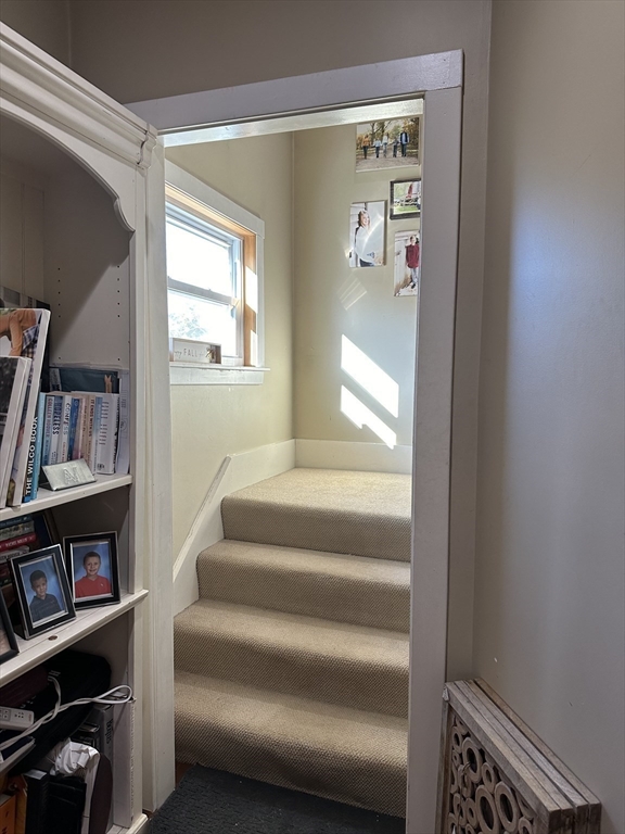 369 Chestnut Street Clinton, MA 01510 - Photo 9 of 21 a view of staircase with white walls and a window