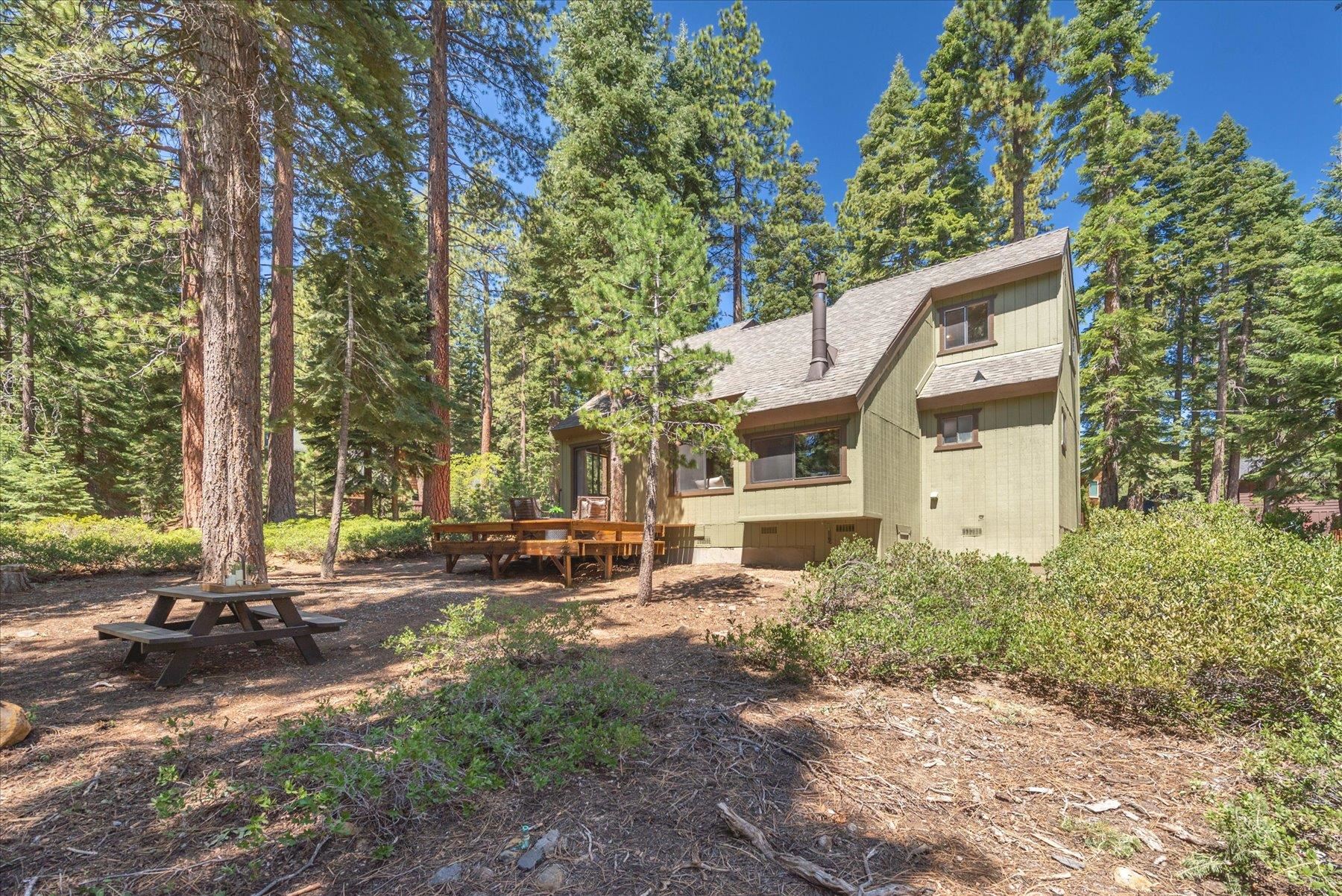 325 North Ridge Road Carnelian Bay, CA 96140 - Photo 1 of 22 a view of a house with a yard and sitting area