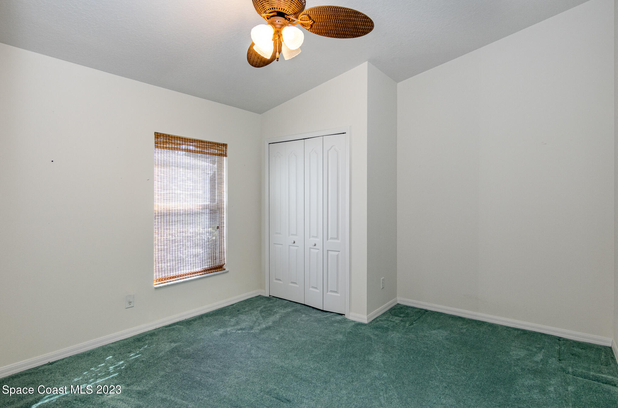 2140 Spring Creek Circle Palm Bay, FL 32905 - Photo 17 of 22 an empty room with a window