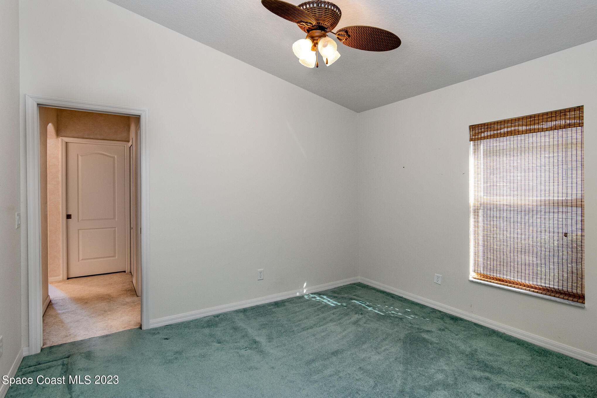 2140 Spring Creek Circle Palm Bay, FL 32905 - Photo 18 of 22 an empty room with a window