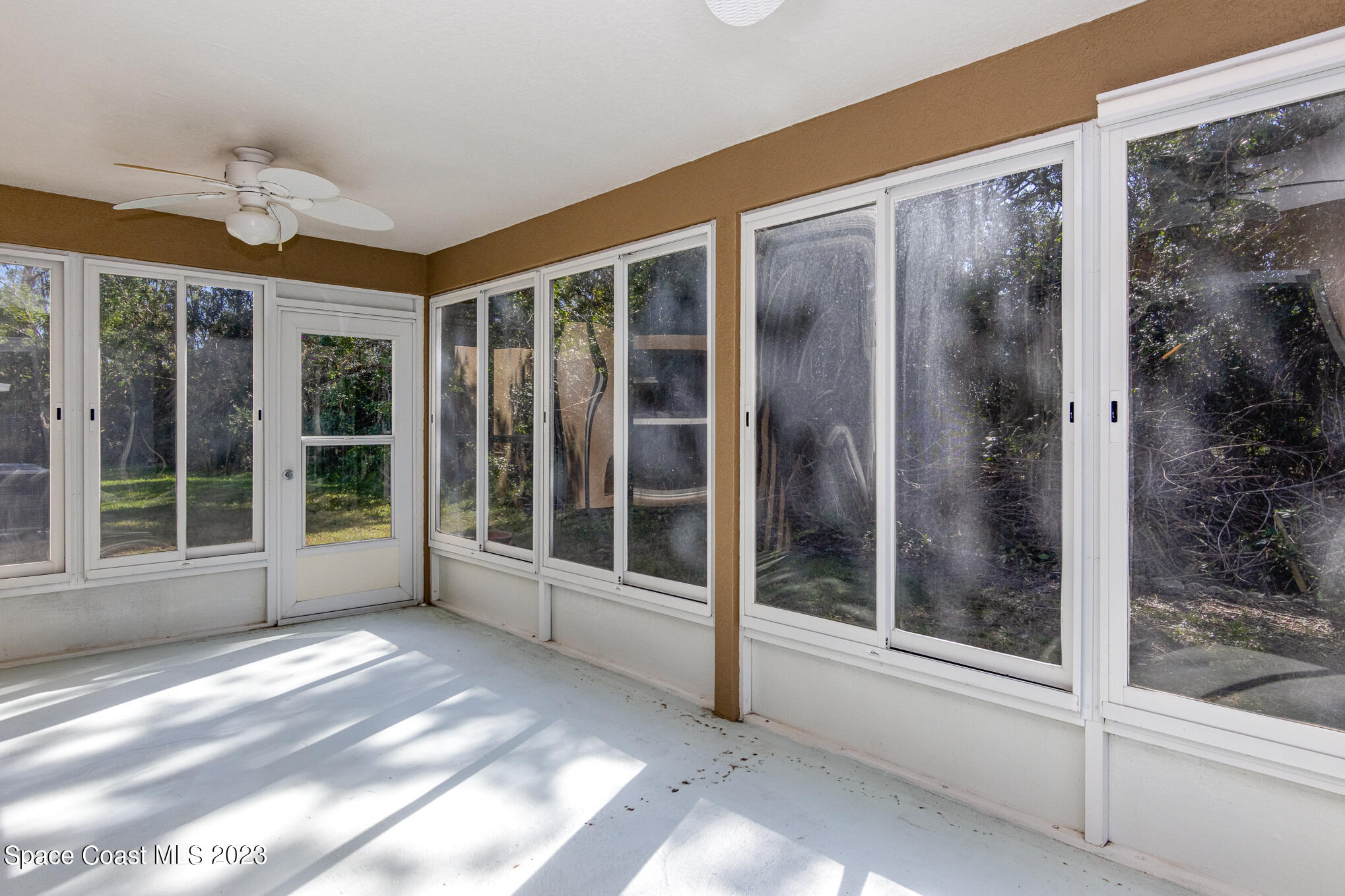 2140 Spring Creek Circle Palm Bay, FL 32905 - Photo 20 of 22 a view of an empty room with a balcony