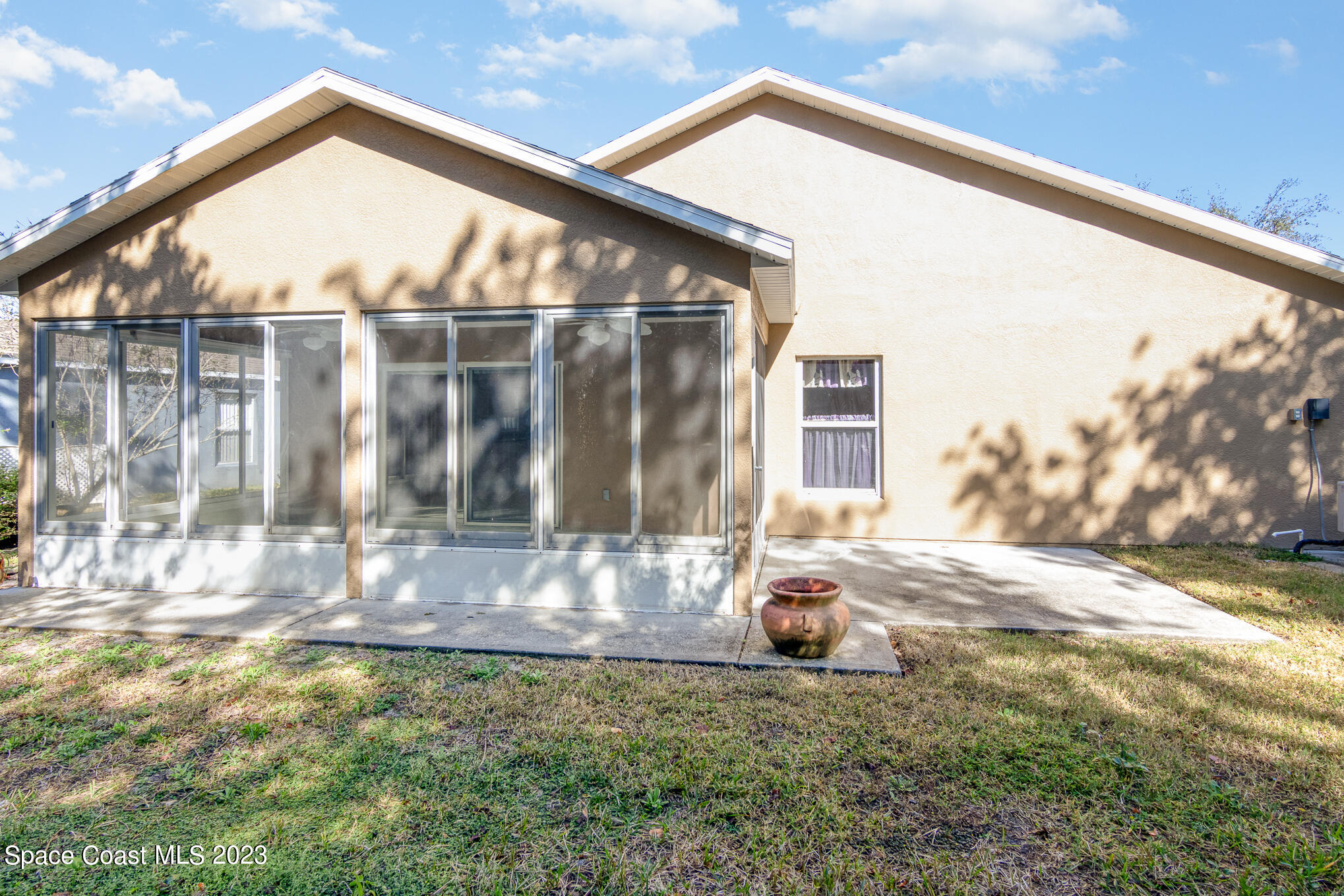 2140 Spring Creek Circle Palm Bay, FL 32905 - Photo 21 of 22 a view of a house with a yard