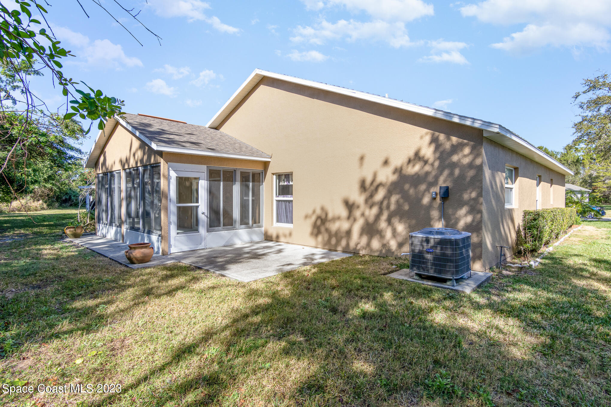 2140 Spring Creek Circle Palm Bay, FL 32905 - Photo 22 of 22 a view of a house with backyard and sitting area