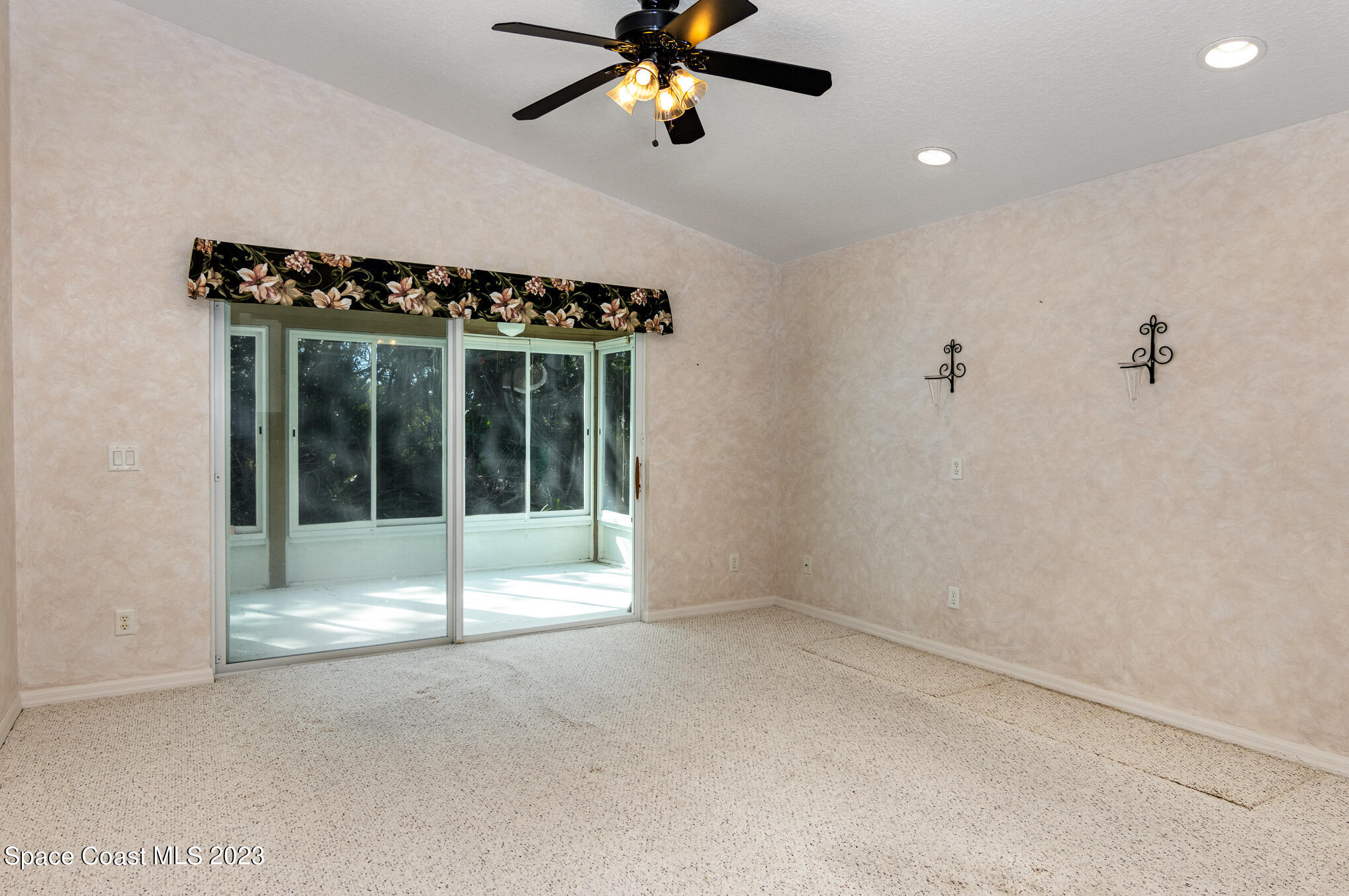 2140 Spring Creek Circle Palm Bay, FL 32905 - Photo 5 of 22 a view of a livingroom with a ceiling fan and window