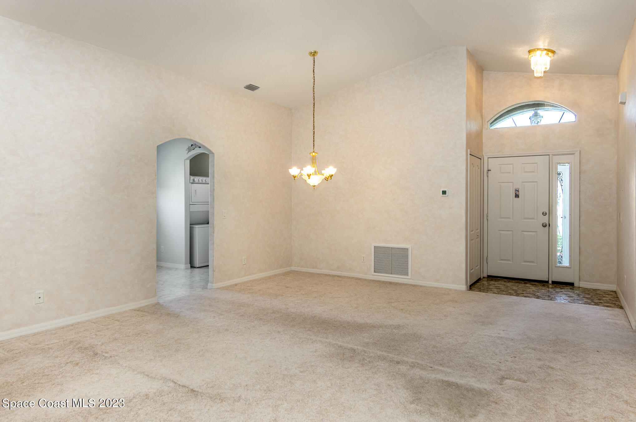 2140 Spring Creek Circle Palm Bay, FL 32905 - Photo 6 of 22 a view of a room with painting on the wall