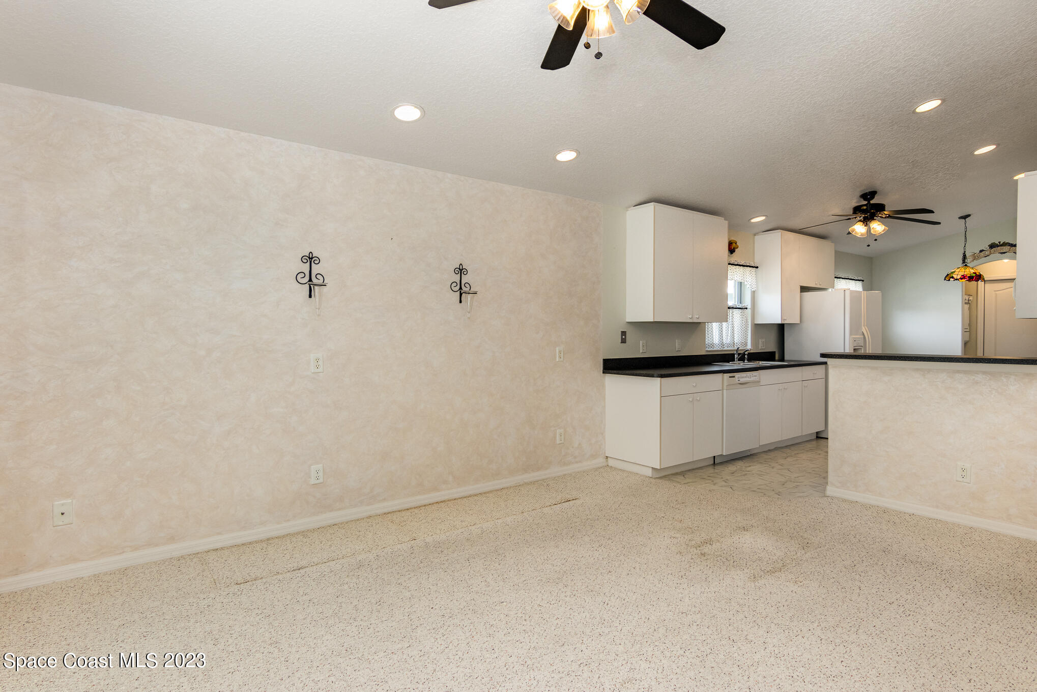 2140 Spring Creek Circle Palm Bay, FL 32905 - Photo 7 of 22 an empty room with a kitchen and a sink